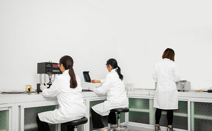 3 technicians working in catalyst adsorbent lab with green and advanced chemical technology